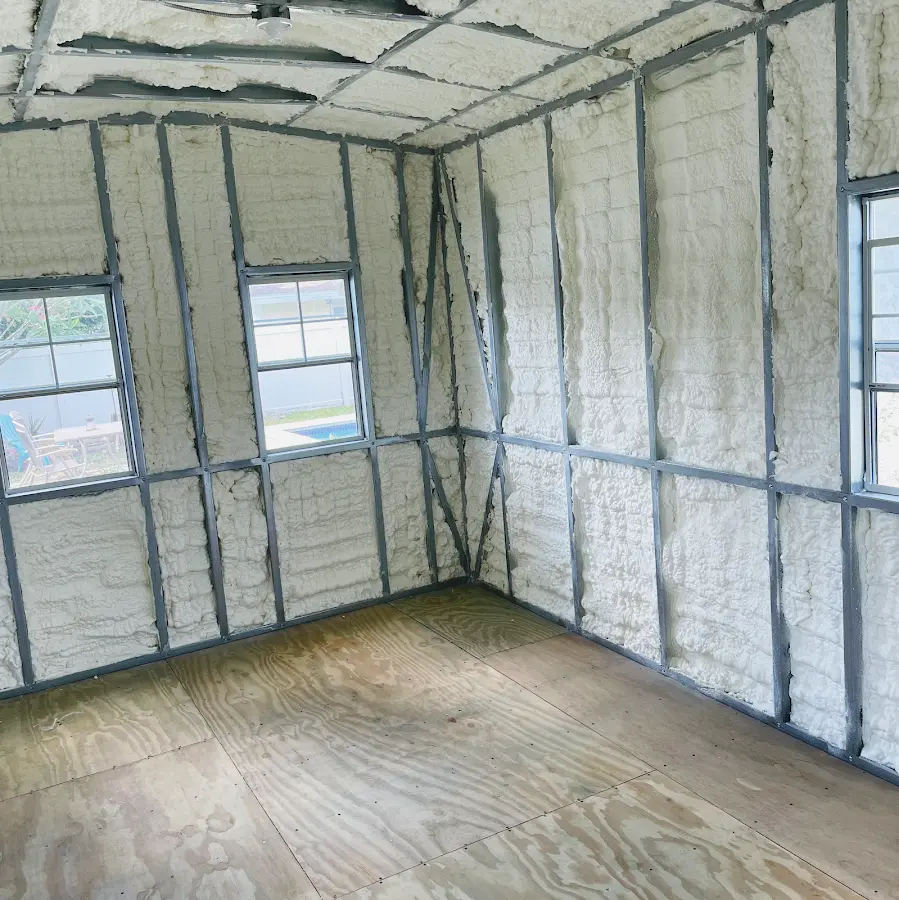 Closed-cell spray foam insulation applied to wall cavities in a residential project in Denison